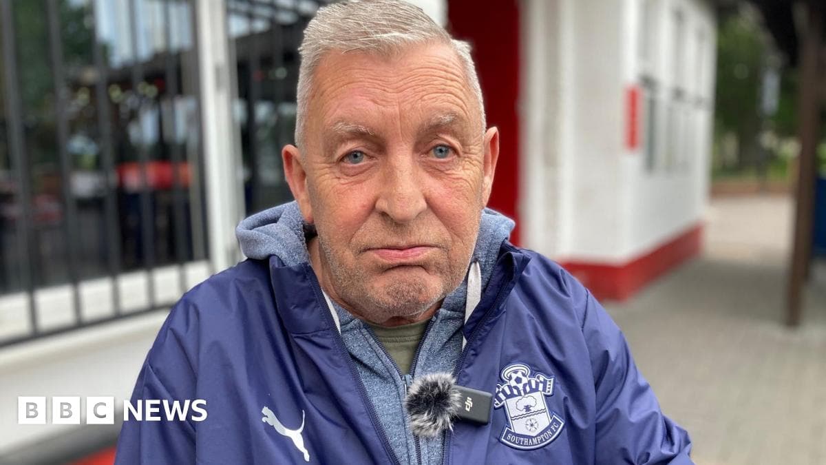 Man wearing Southampton FC jacket outdoors