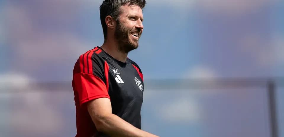 Coach Michael Carrick smiling during training session
