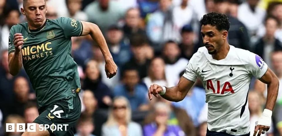Two players running during a football match