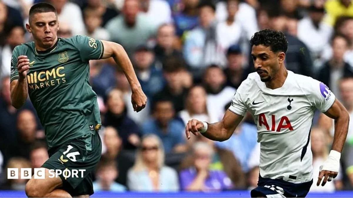 Two players running during a football match