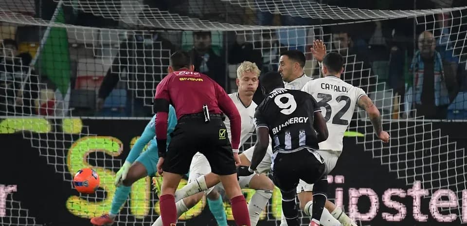 Lazio player attempting to block Udinese shot