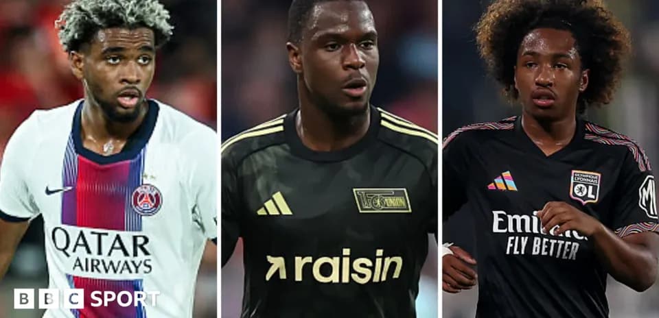 Three football players in club jerseys on the pitch