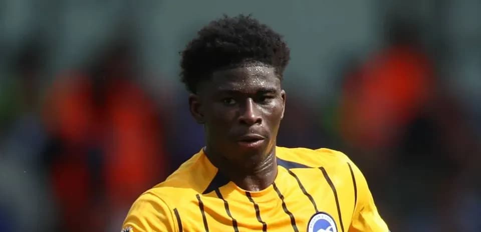 Player in yellow kit running during a match