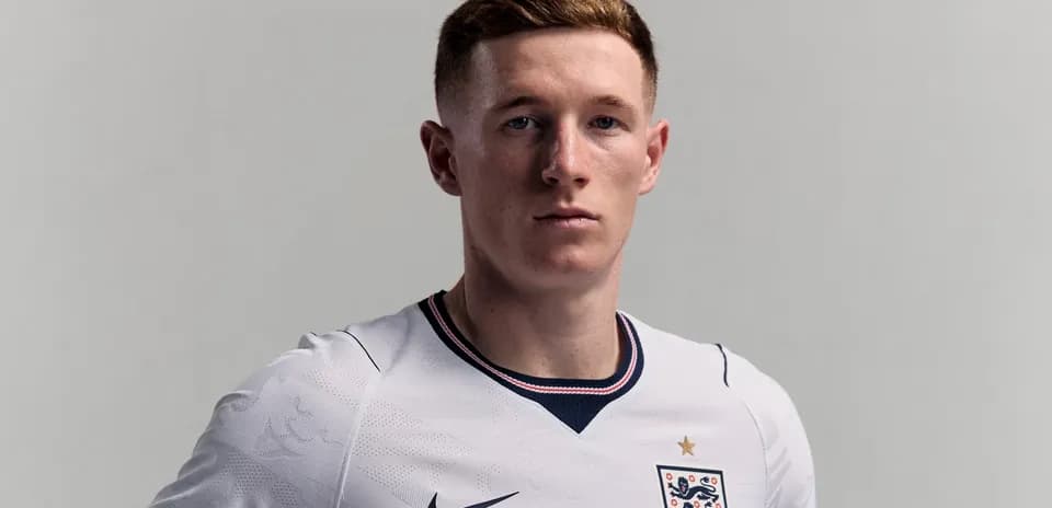 Player in England national team jersey posing confidently