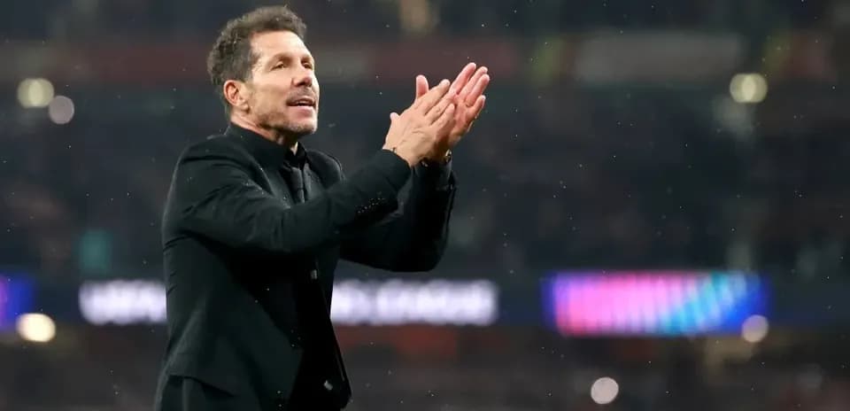 Manager applauding fans during match at stadium