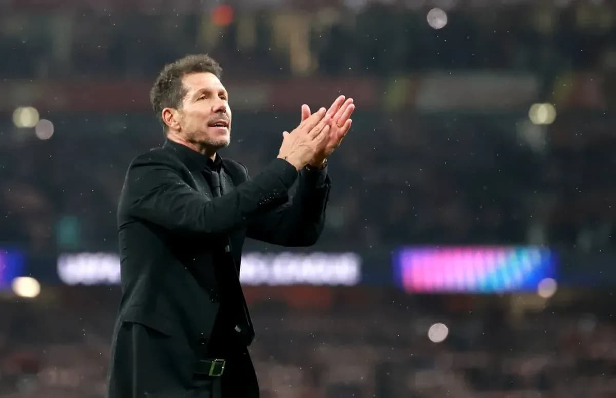 Manager applauding fans during match at stadium