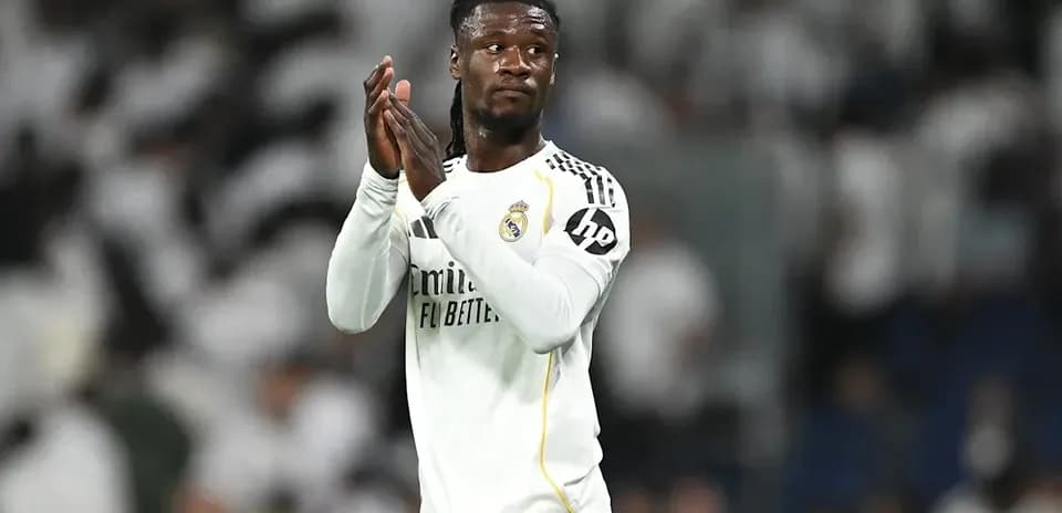 Player applauding fans after match at stadium