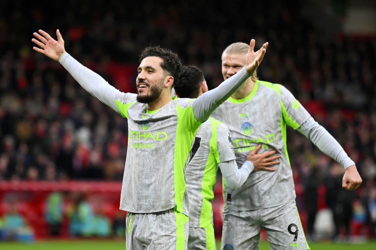 Manchester City players celebrating a goal