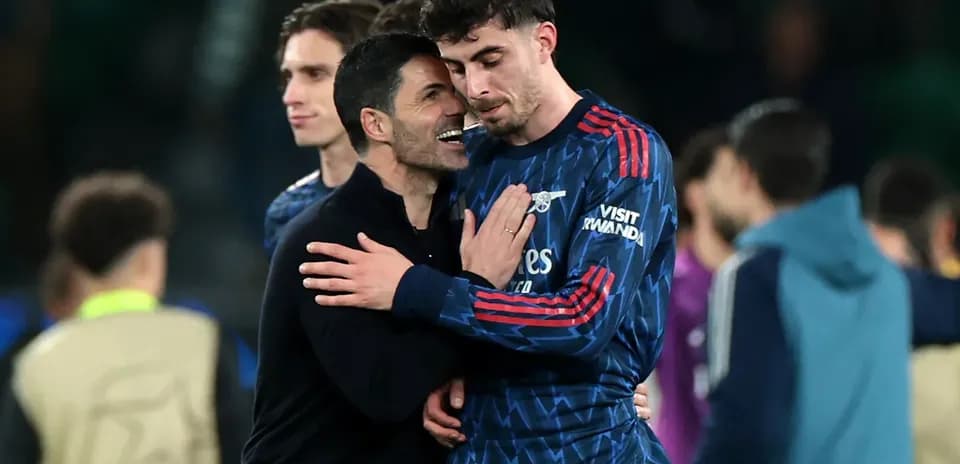 Manager embracing player after match celebration