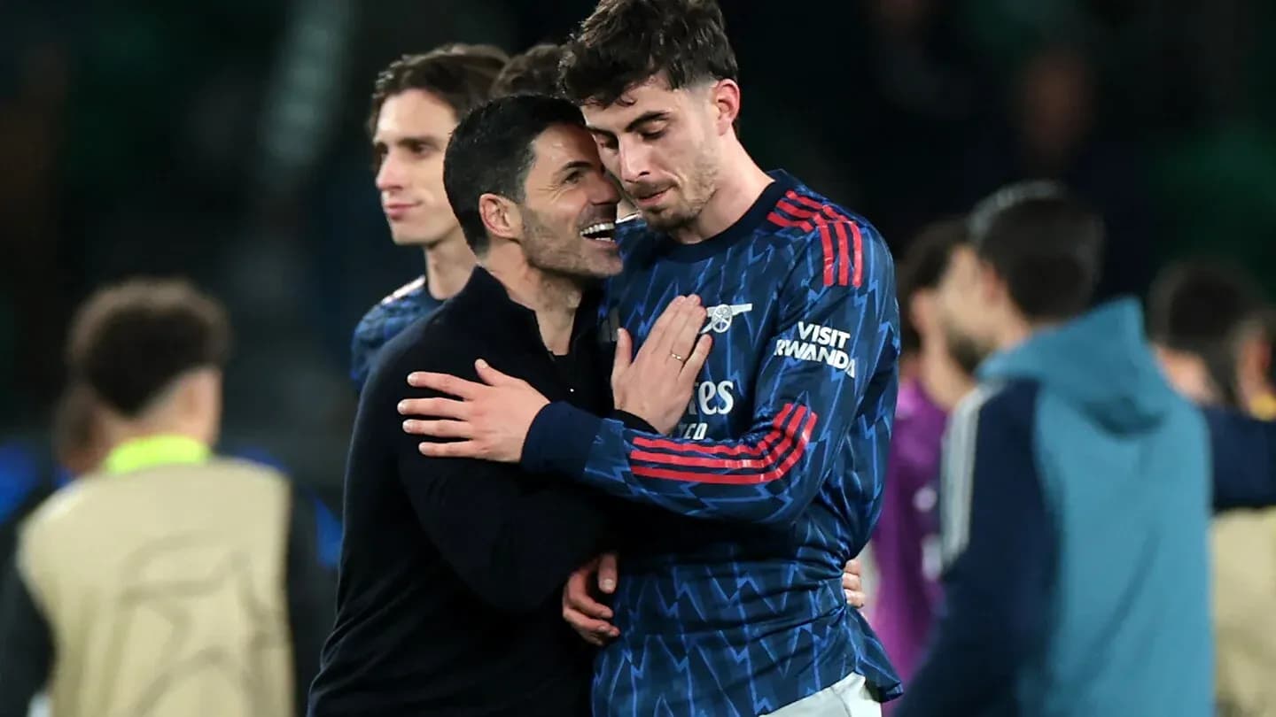 Manager embracing player after match celebration