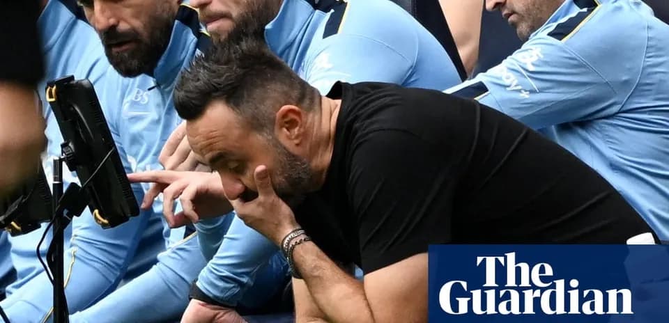 Coaches observing match with concern on sidelines