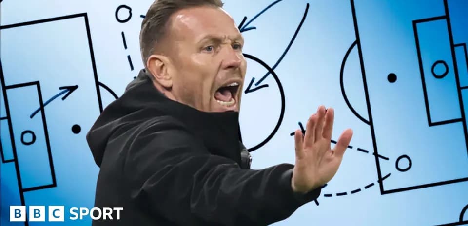 Coach gesturing during tactical discussion on screen