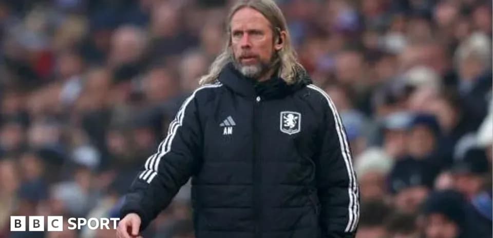 Manager on the sideline during a match