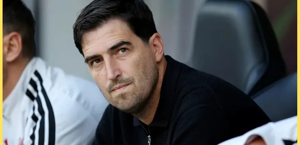 Coach sitting on the bench during a match