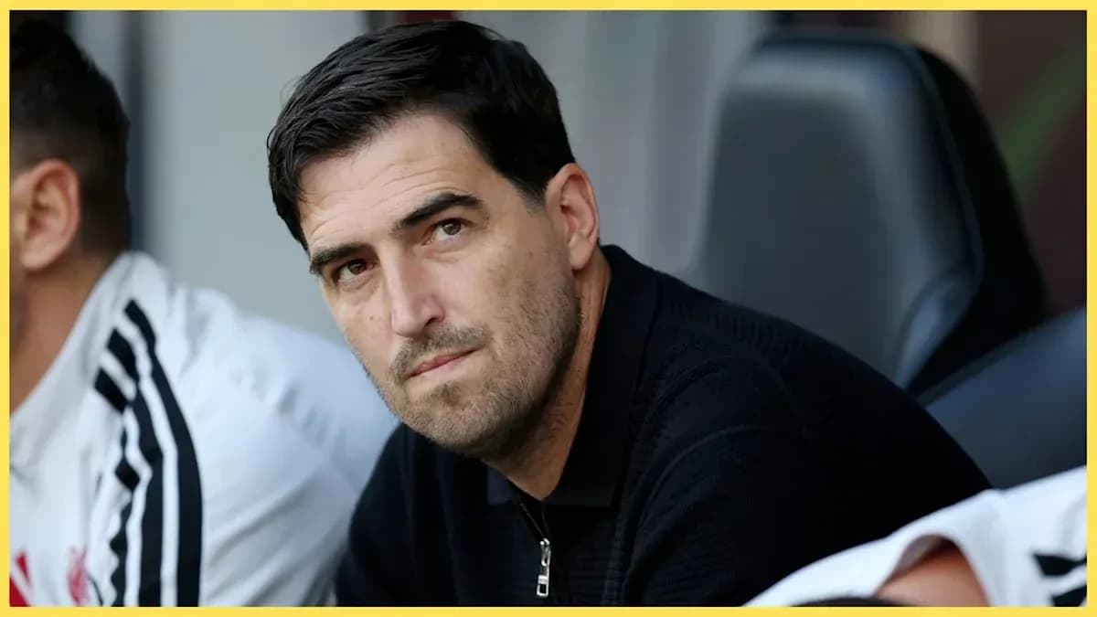 Coach sitting on the bench during a match