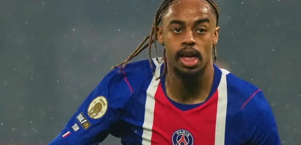 Player running during a match wearing PSG jersey