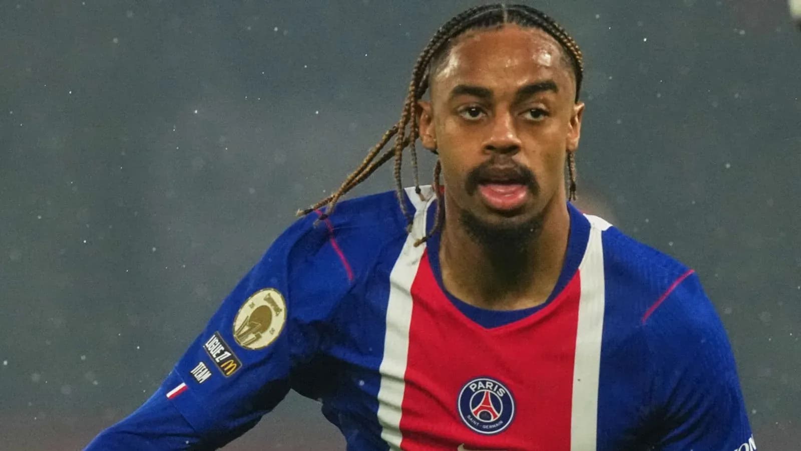 Player running during a match wearing PSG jersey