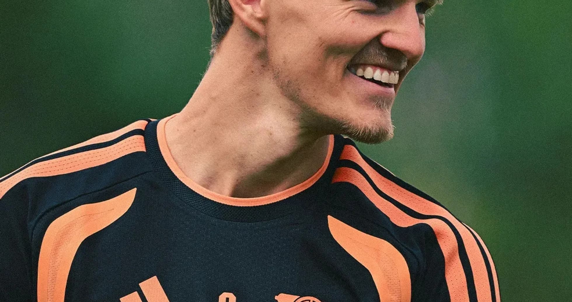 Player smiling during training session in team jersey