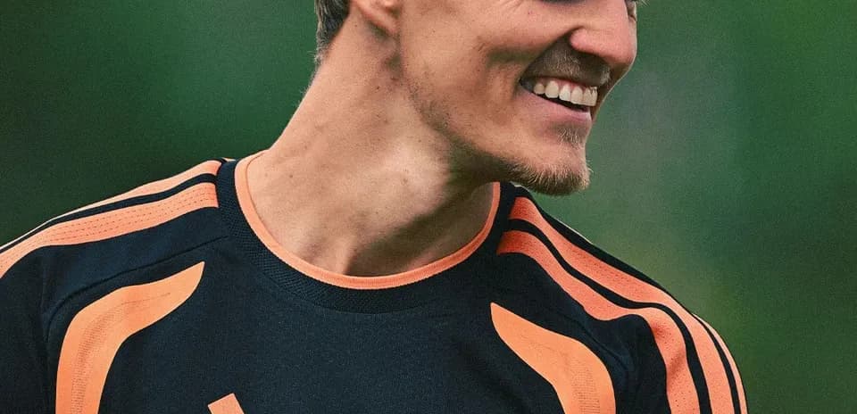 Player smiling during training session in team jersey
