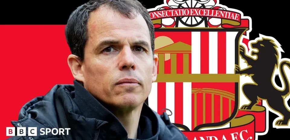 Manager in front of Sunderland AFC logo backdrop