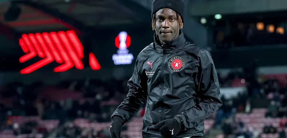 Player warming up on pitch before match