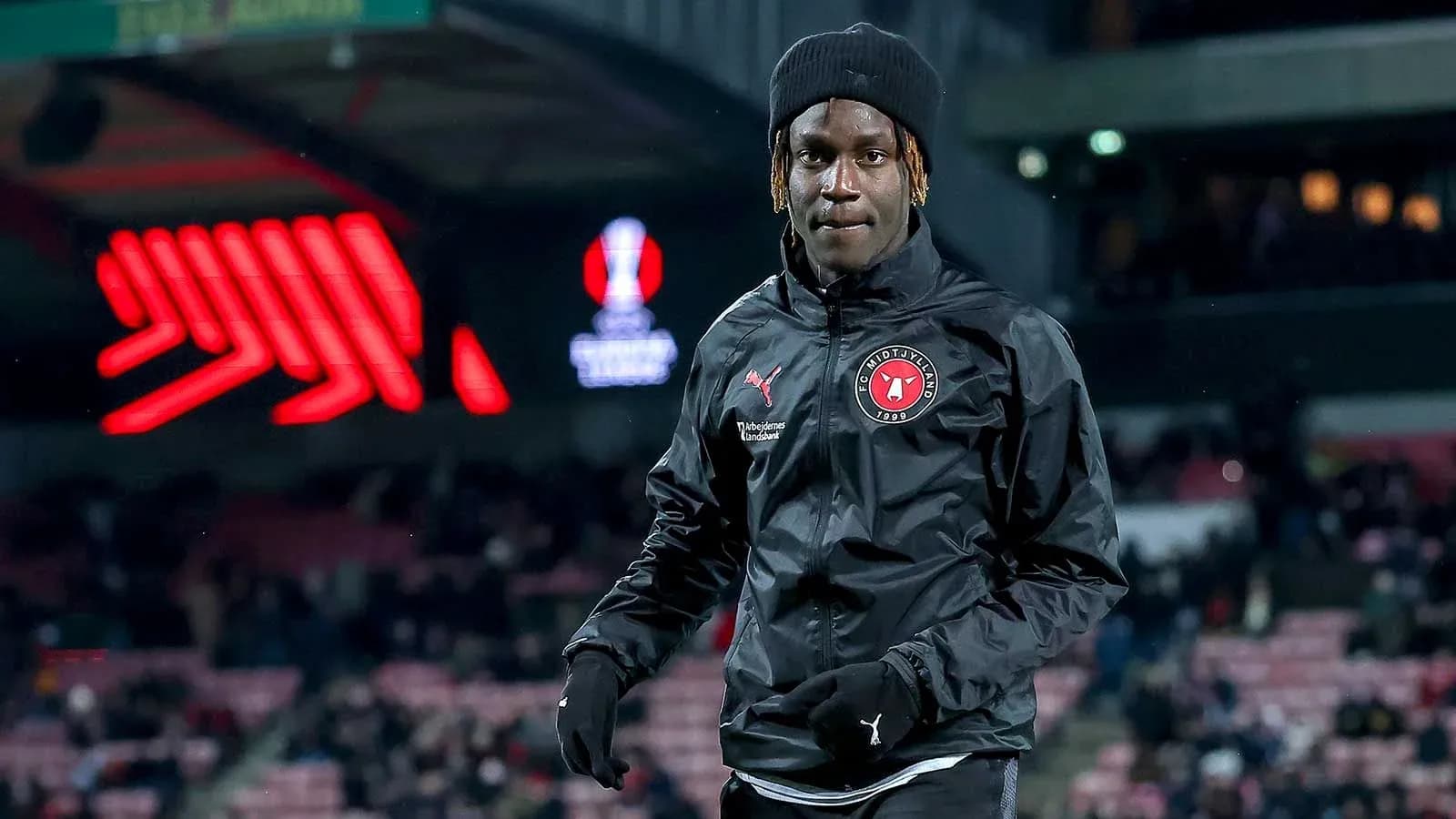 Player warming up on pitch before match