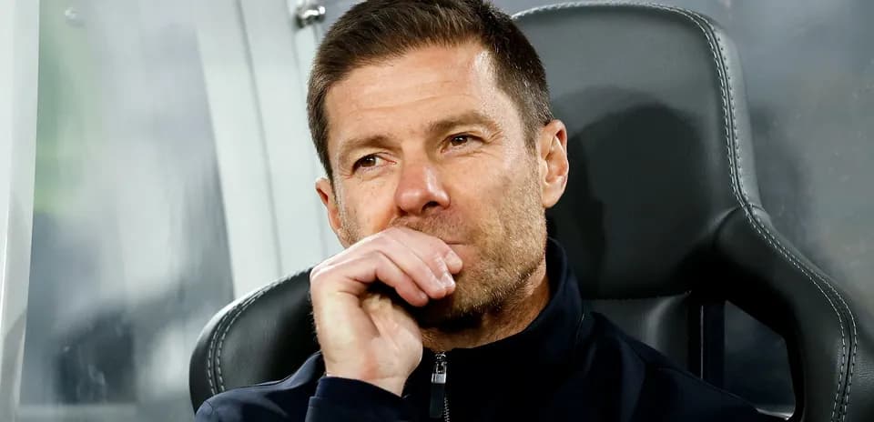 Coach sitting on the bench during a match