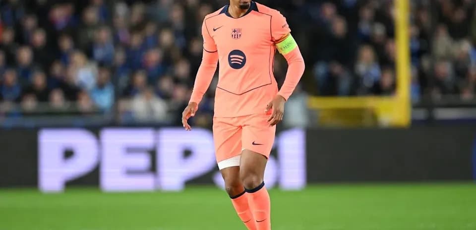 Player in pink jersey controlling ball on field