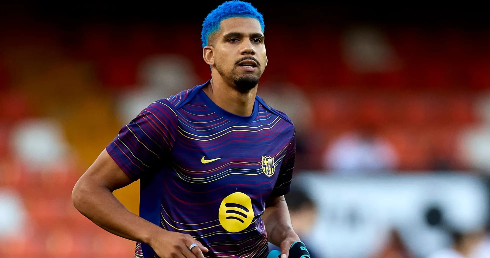 Player warming up in Barcelona training kit
