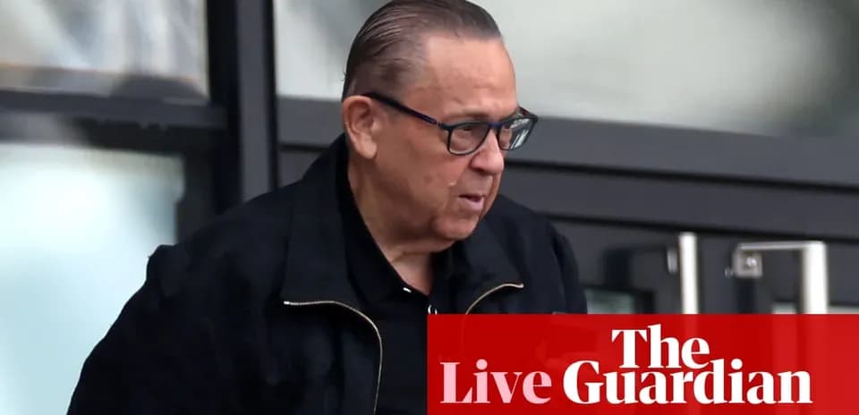 Man wearing glasses walking outside a building