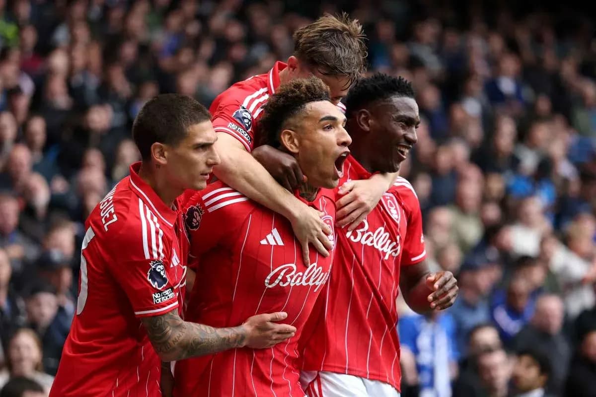 Players celebrating a goal in red jerseys