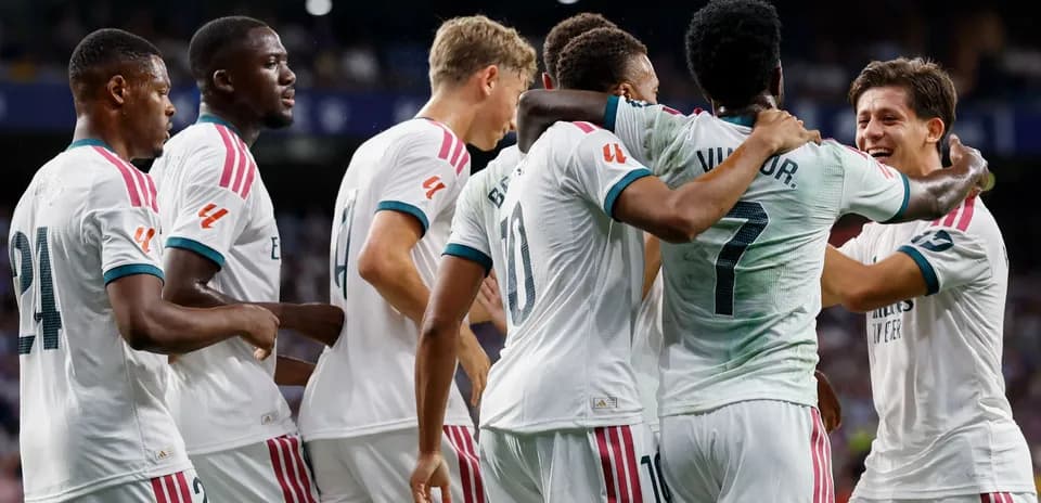 Real Madrid players celebrating a goal