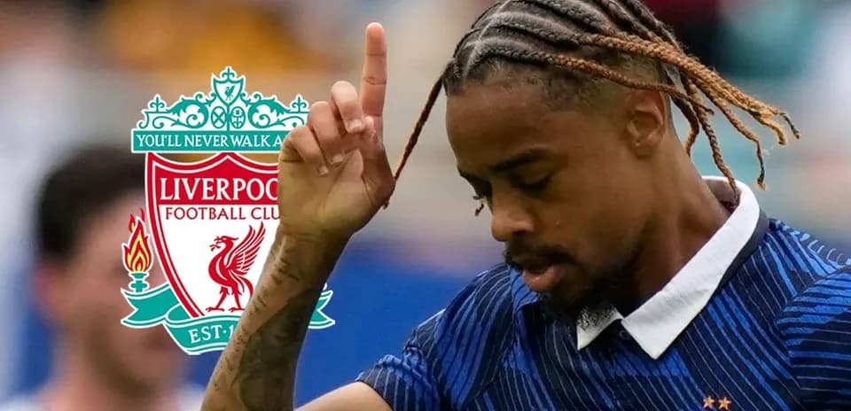 Player celebrating with Liverpool logo in background