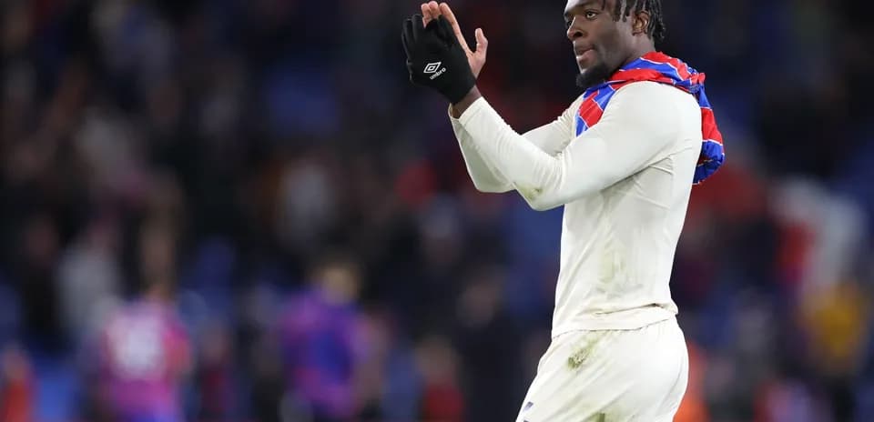 Player applauding fans after the match