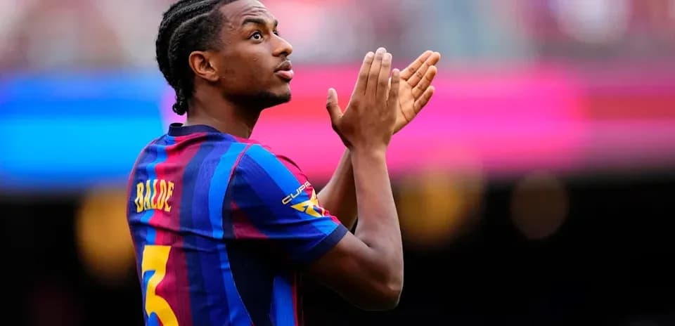 Player applauding fans during match at stadium