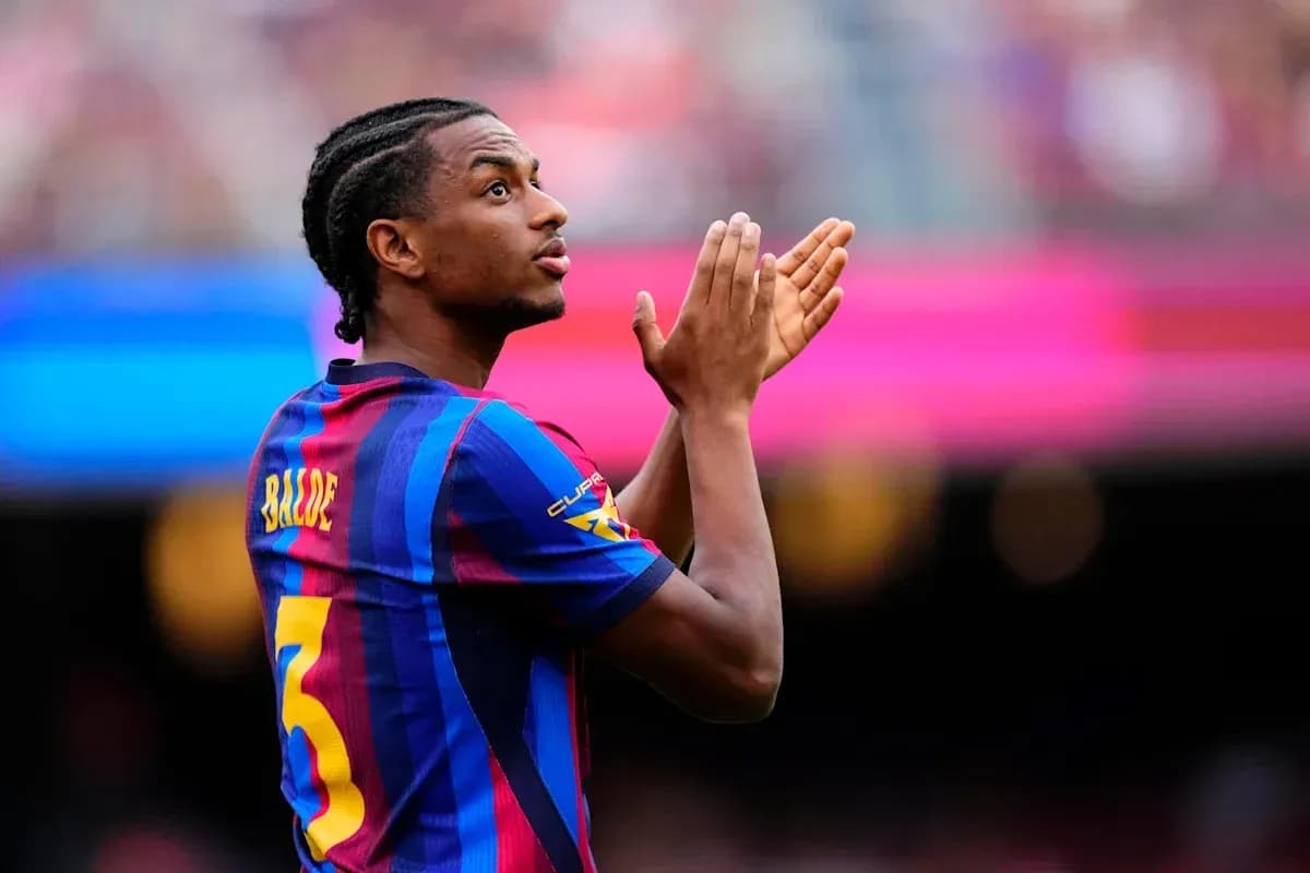 Player applauding fans during match at stadium