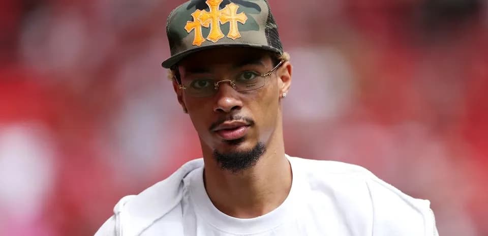 Man wearing a camo hat and glasses