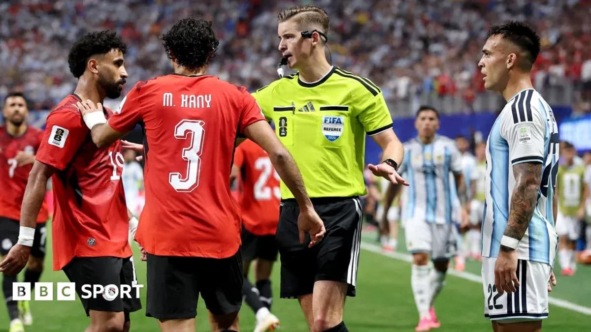 Players arguing with referee during match stoppage