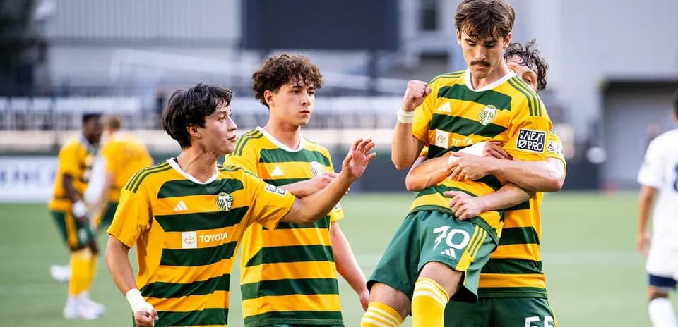 Players celebrating a goal for Portland Timbers II