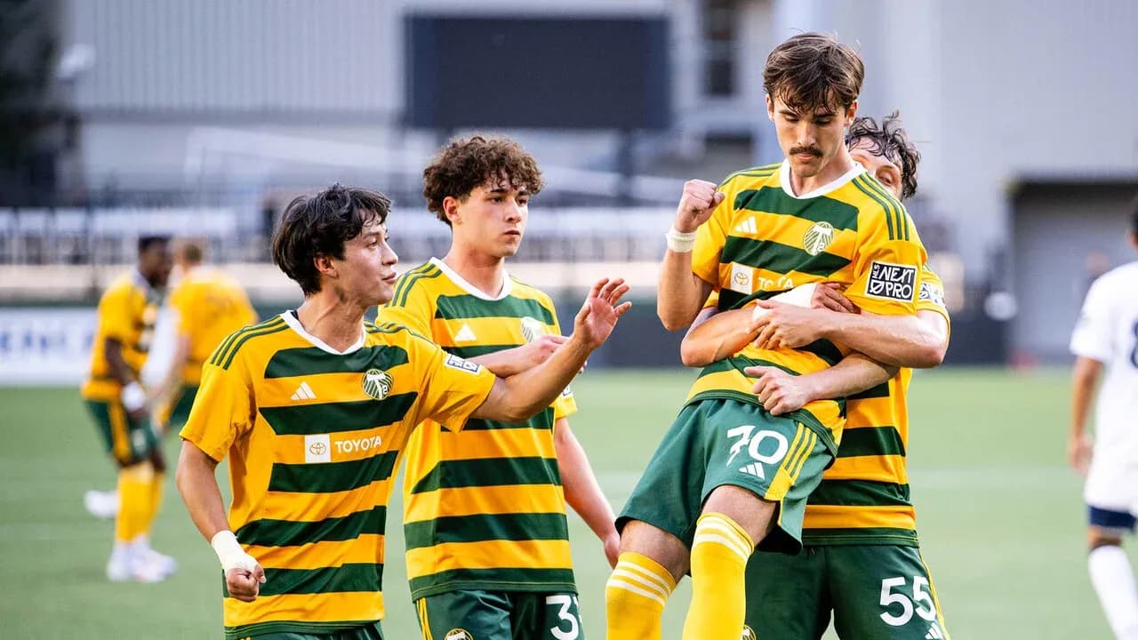Players celebrating a goal for Portland Timbers II