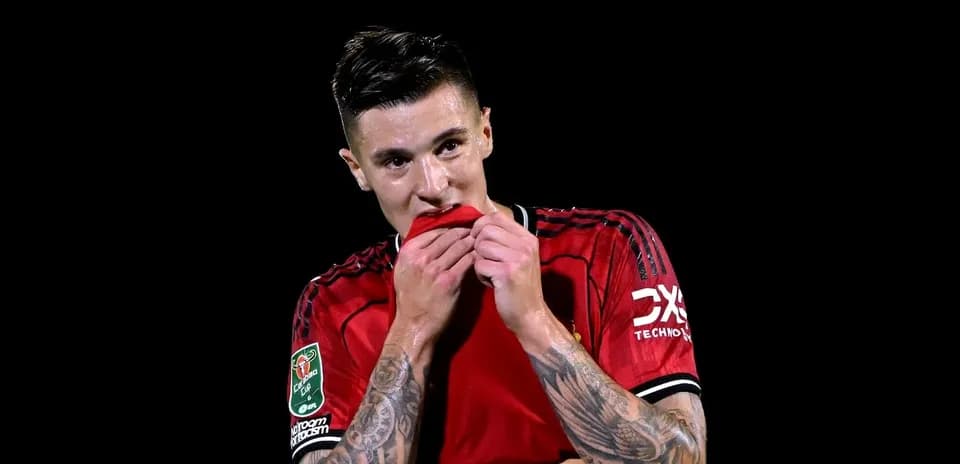 Player holding shirt during match celebration