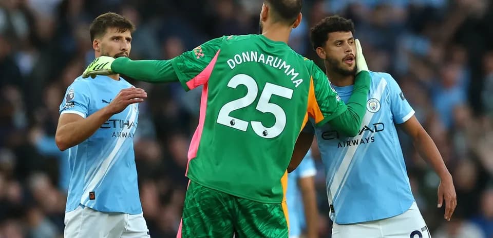 Manchester City players discussing during Premier League match