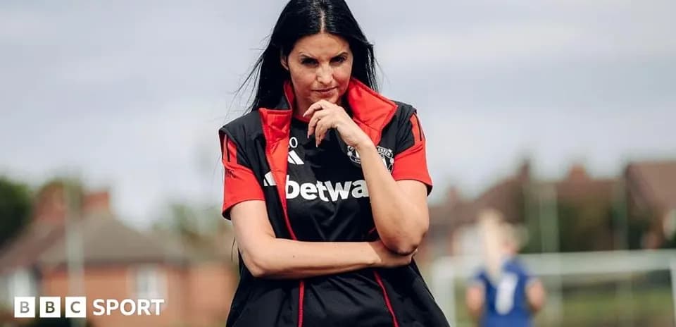 Coach observing players during training session