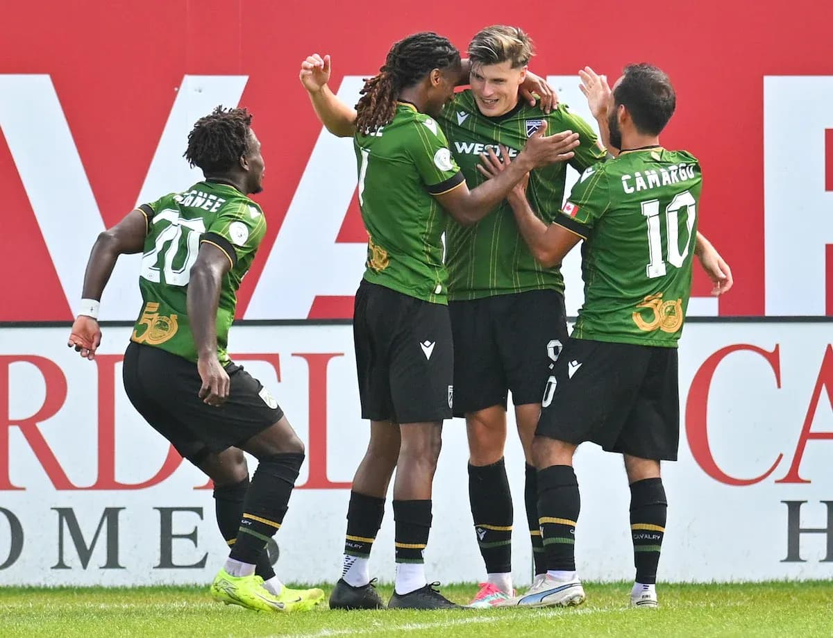 Players celebrating a goal during Forge vs Cavalry FC