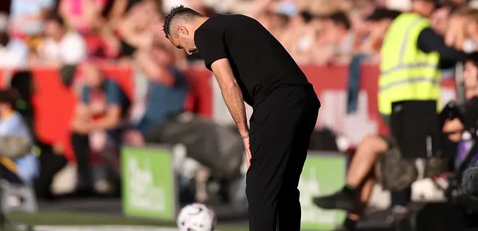 Coach observing the game from the sideline