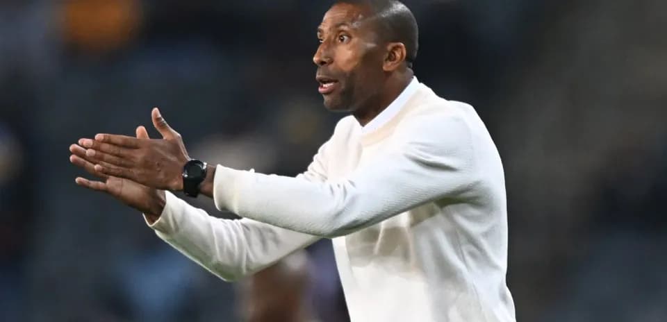 Coach gesturing during a match on the sidelines
