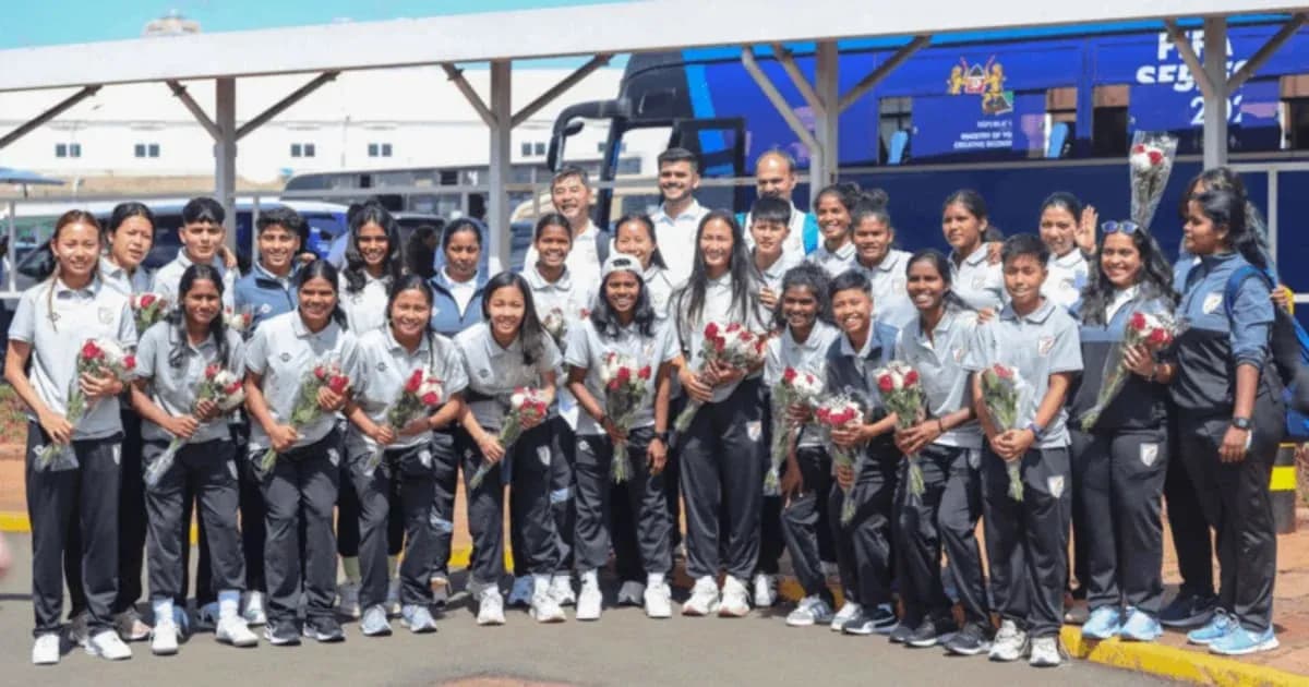 Women's sports team posing with flowers at airport