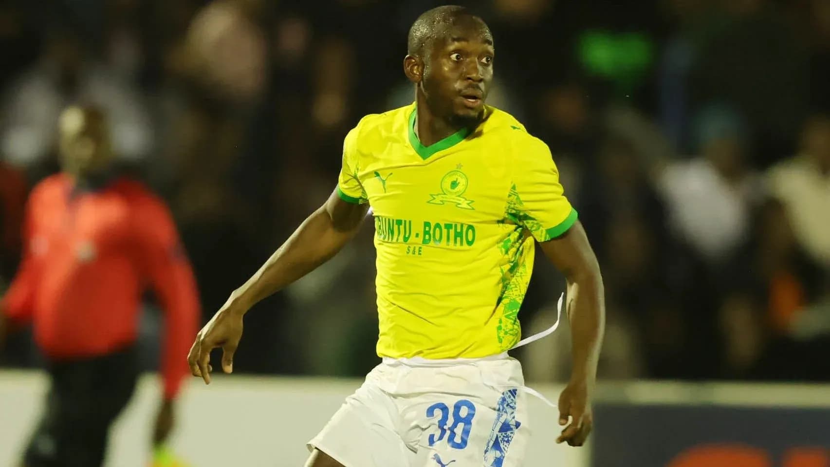 Player in yellow jersey during football match