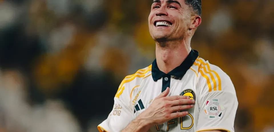 Player celebrating joyfully in team uniform
