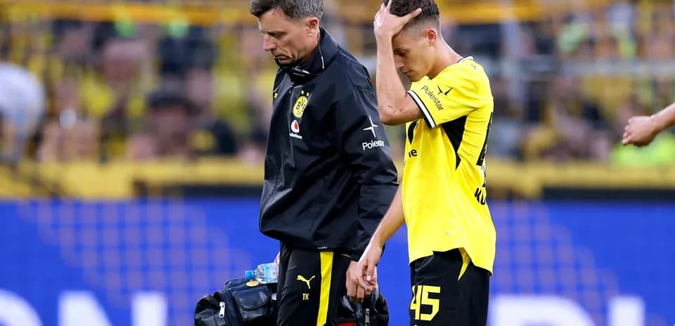Player receiving medical attention leaving the field